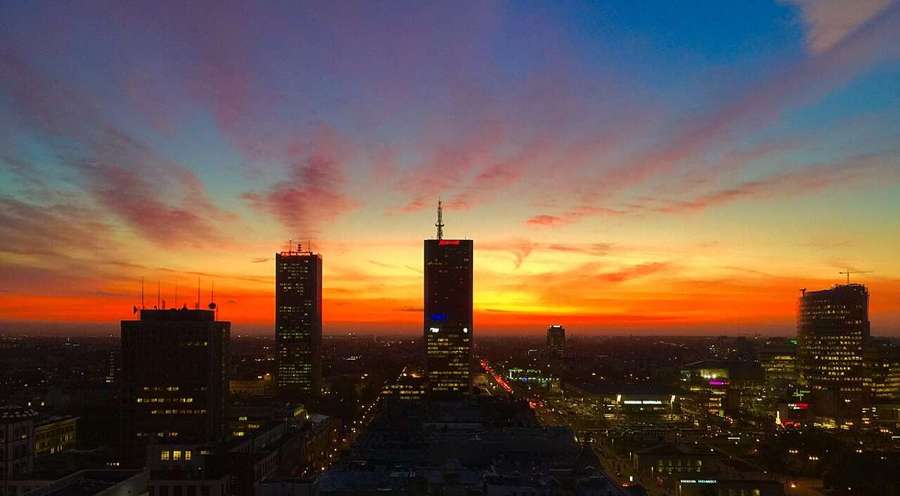 Warsaw skyline at dusk with the Palace of Culture and Science