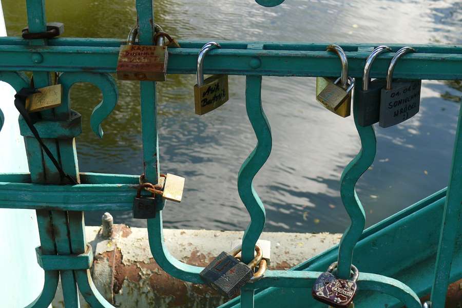 Love padlocks on a bridge railing - a fixture of Polish dating spots from Krakow to Opole