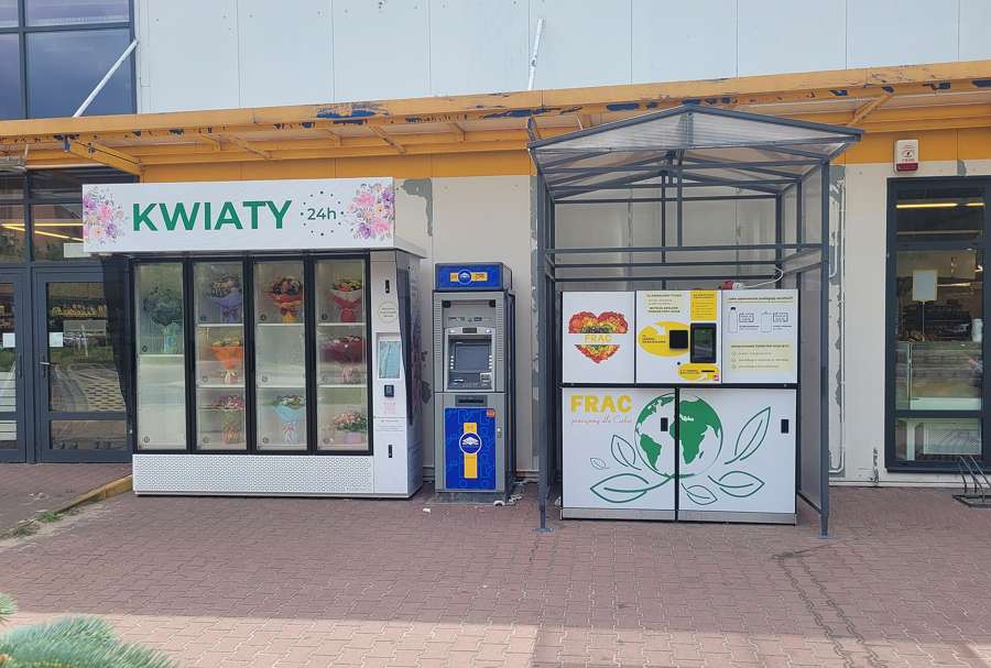 A KWIATY 24h flower vending machine with wrapped bouquets on Bonifacego Street in Warsaw