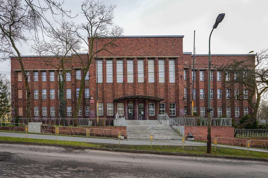 A brick Polish primary school building in winter