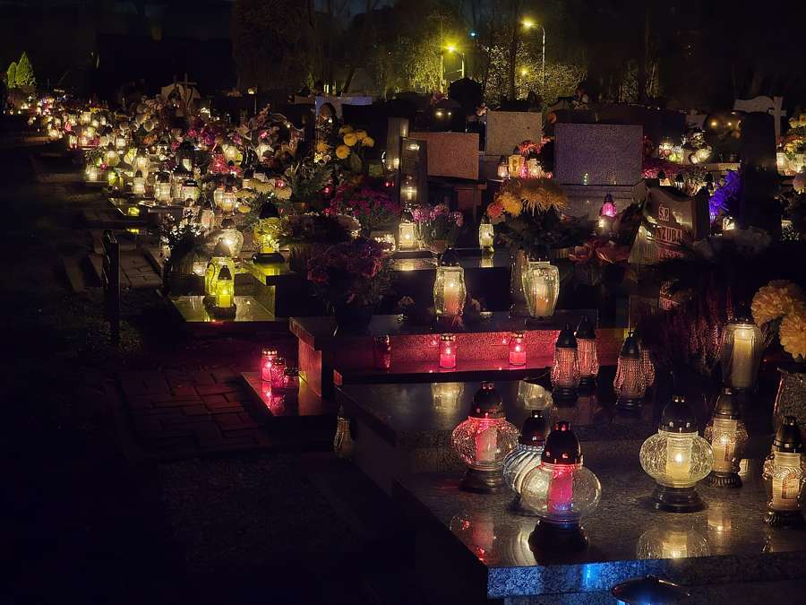 Cemetery candles on All Saints Day - one of Poland shared rituals newcomers are welcome to join respectfully