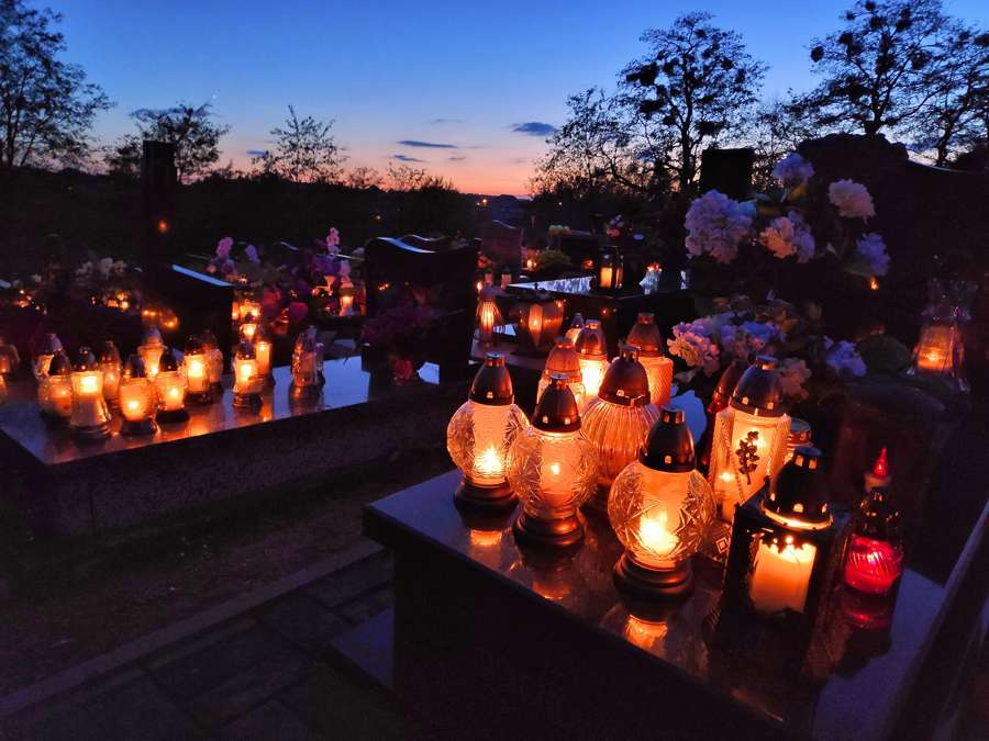 Candle-lit graves on All Saints Day in Poland, a shared national ritual every newcomer should understand