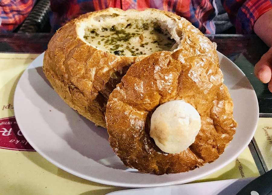 Zurek, Polish sour rye soup, served in a bread bowl with a hard-boiled egg