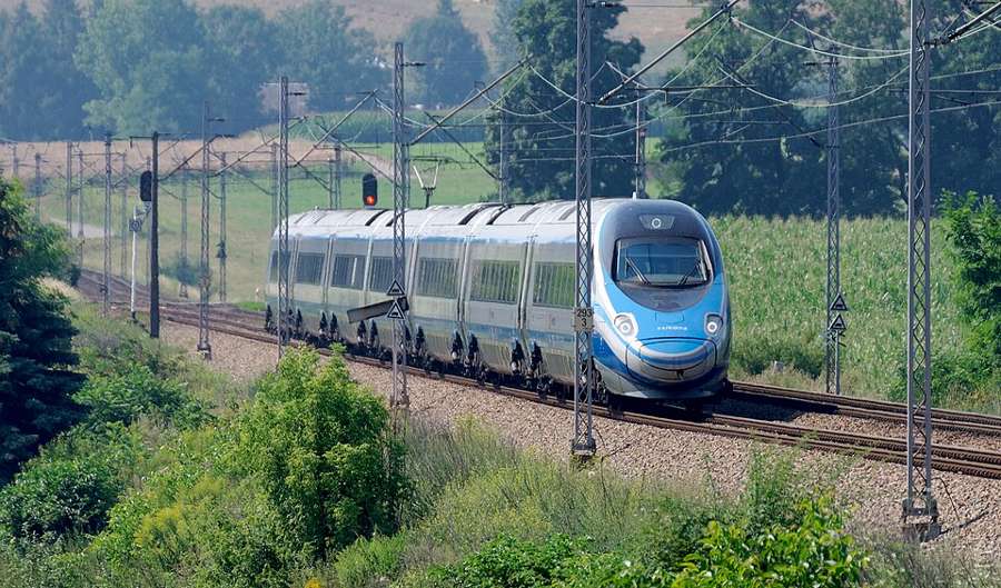 A PKP Intercity Pendolino ED250 train on a curve near Slomniki