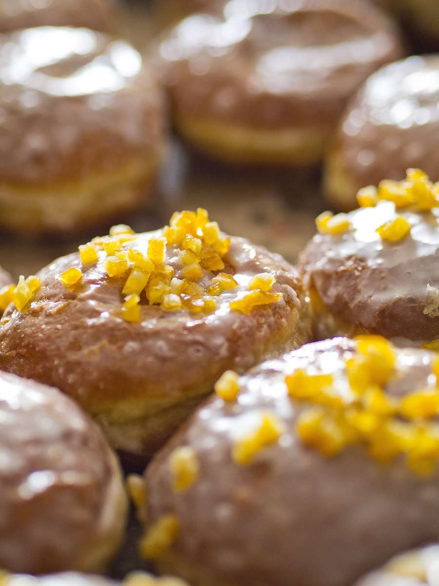 Glazed pączki with candied orange peel - the doughnuts Poland queues for on Tłusty Czwartek