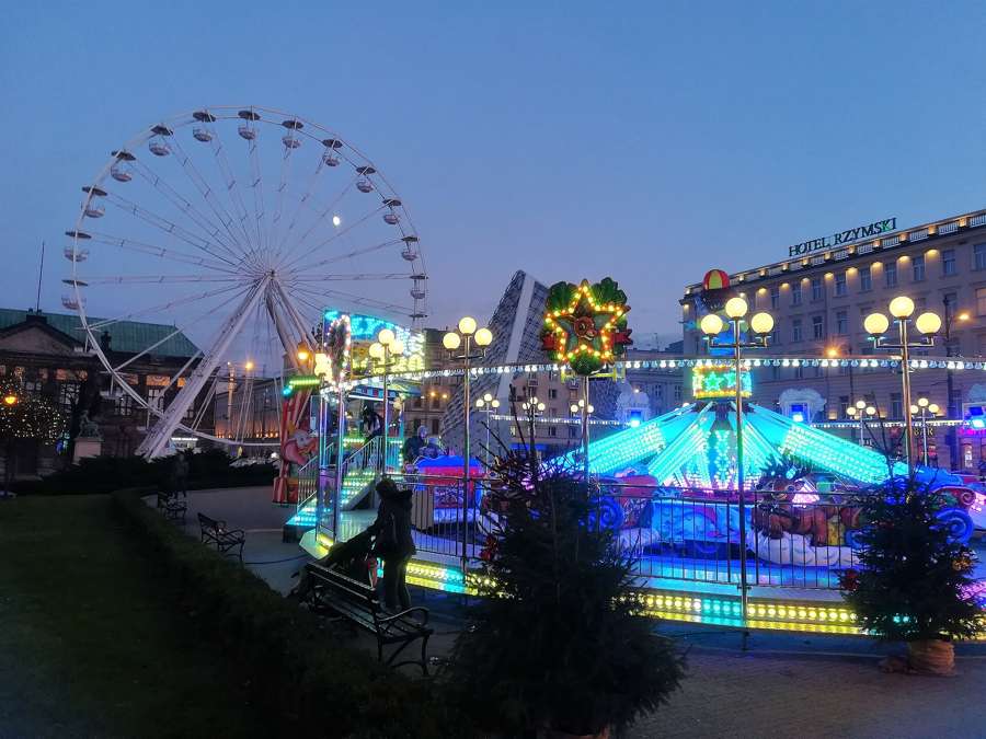 The Ferris wheel and illuminated carousel on Plac Wolnosci at the Poznan Christmas market, December 2017