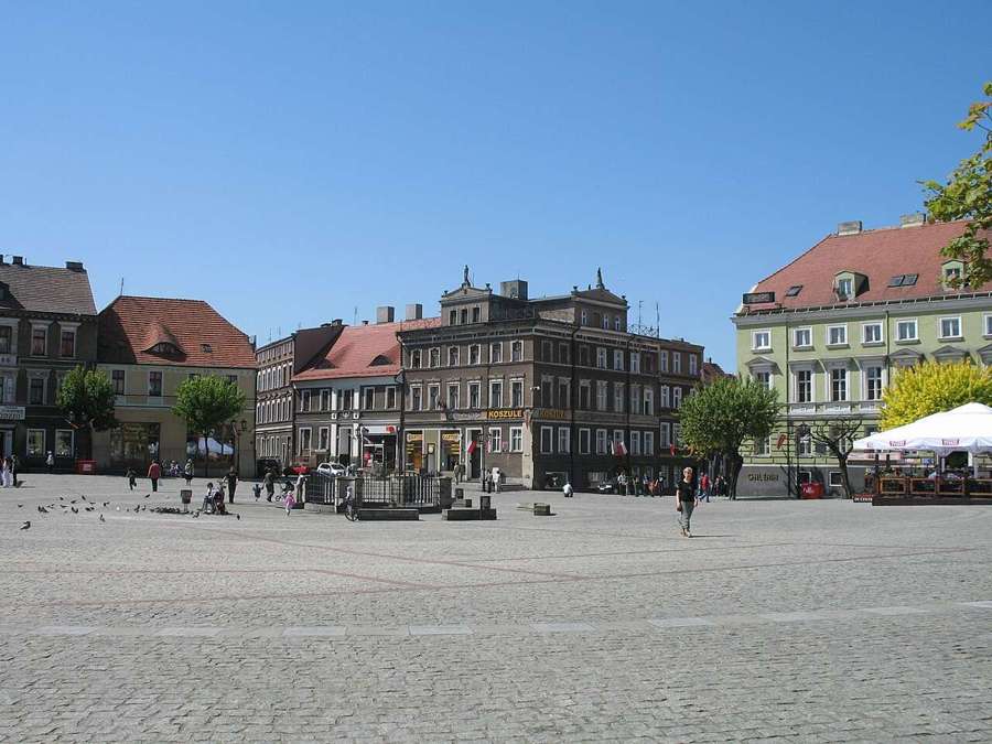 Market square with townhouses in Gniezno, Poland