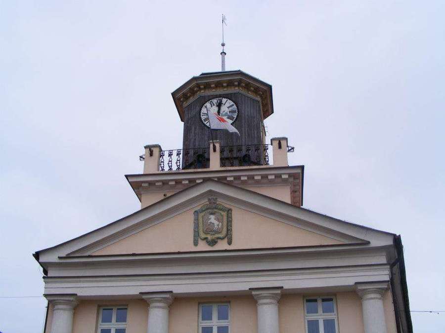 Clock tower of a historic building in Konin, Poland
