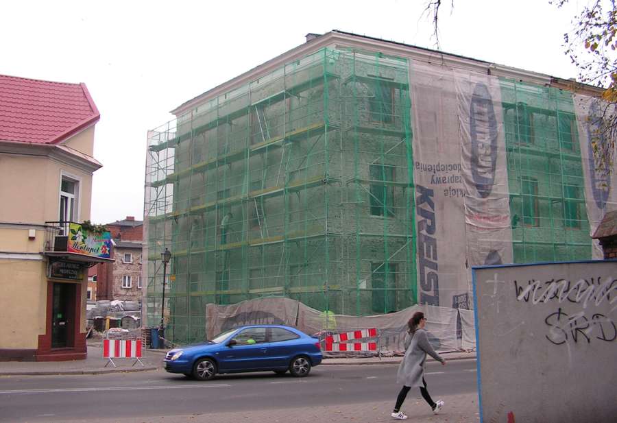 A tenement building in Poland undergoing facade renovation