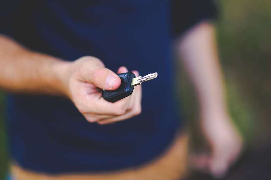 A key being handed over