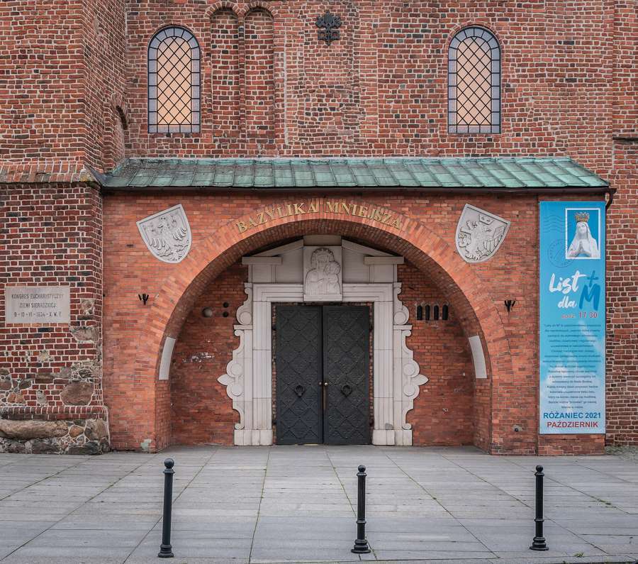 The Gothic brick portal of the All Saints collegiate church in Sieradz
