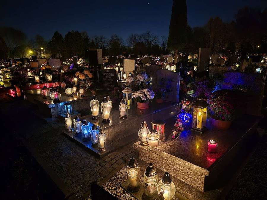 Candles on graves in a Polish cemetery