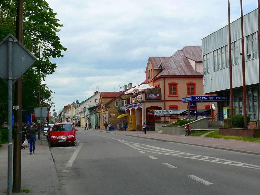 Street in Suwałki with shops and traffic