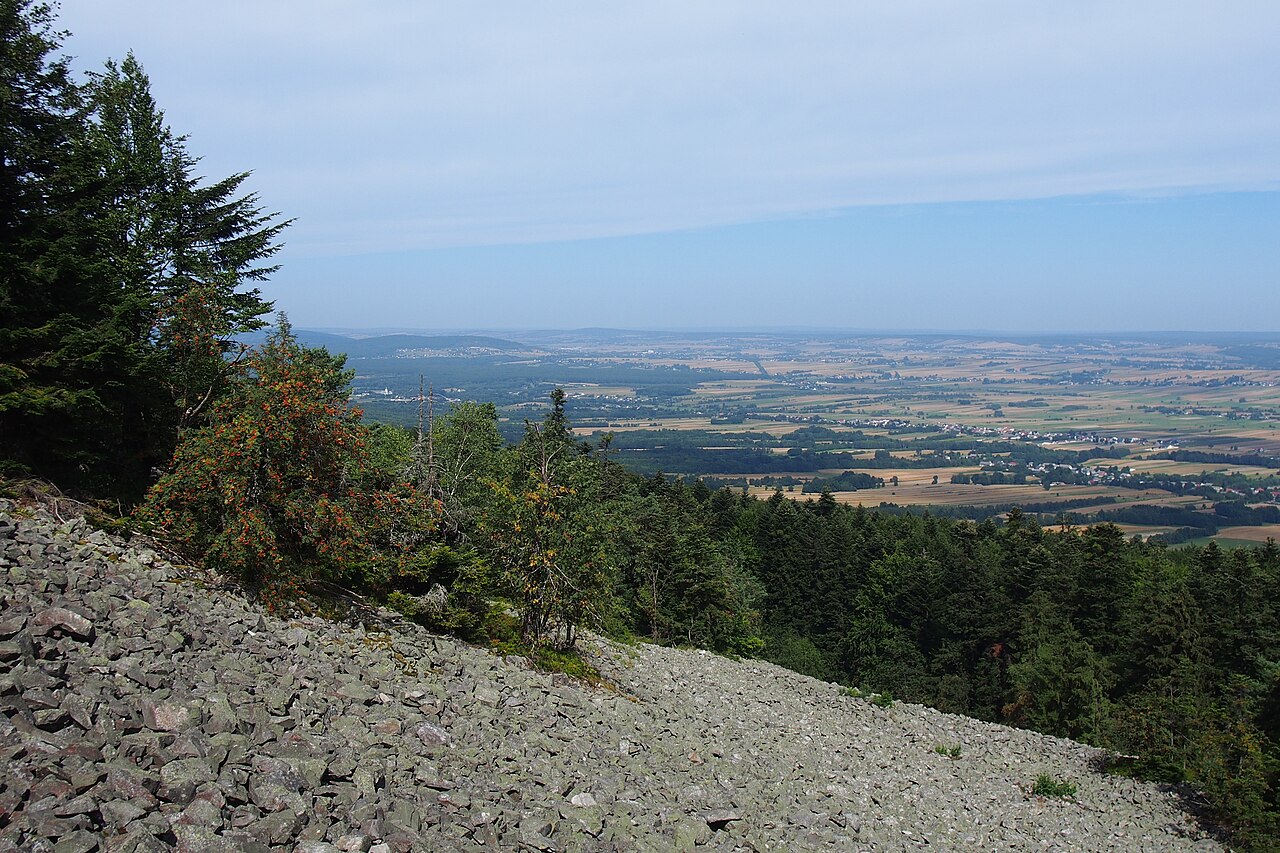 The gołoborze quartzite blockfield on Łysa Góra with a view over the Świętokrzyskie foothills