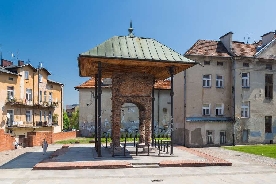 The brick bimah of Tarnów's Old Synagogue, preserved under a canopy in the former Jewish quarter