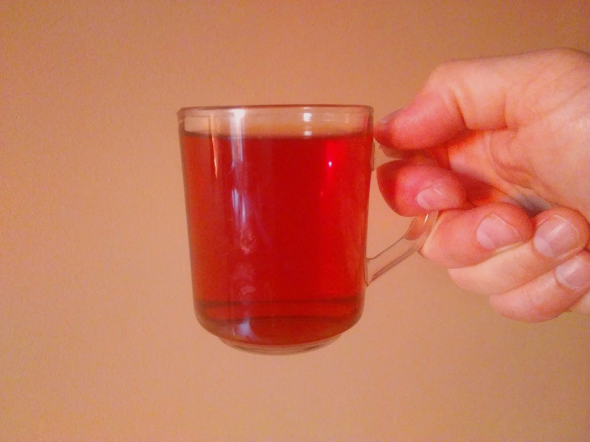 A glass mug of red fruit tea, the everyday Polish herbata owocowa