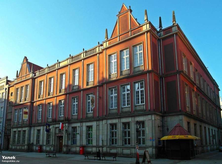 A historic red-brick Poczta Polska post office building in Gdansk, Poland