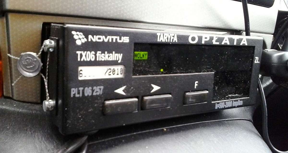 A sealed electronic taximeter in a Polish taxi