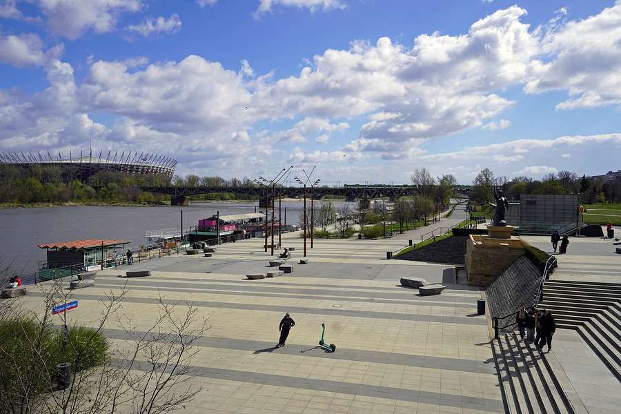 The Vistula Boulevards at Bulwar Pattona, with the river, water-gauge sculpture and National Stadium across the water