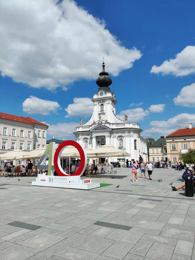 The Basilica of the Presentation of the Virgin Mary in Wadowice with a 600th anniversary sign