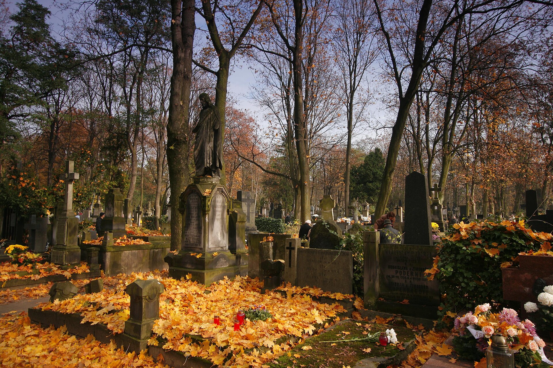 Powazki cemetery in Warsaw covered in autumn leaves and candles on 1 November 2009