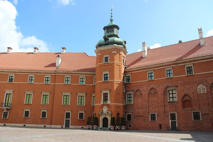 Royal Castle courtyard in Warsaw with its clock tower and red roofs
