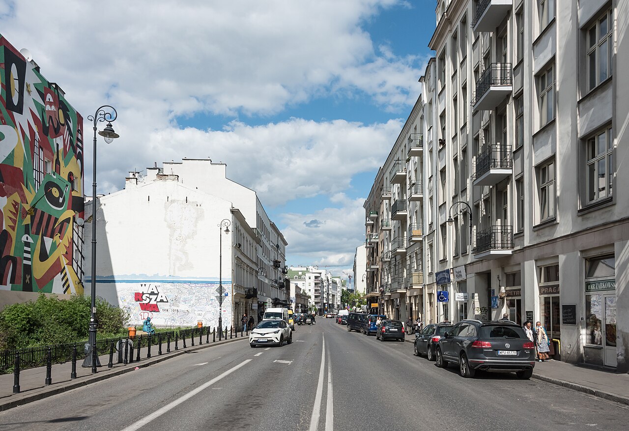 Ząbkowska street in Praga with large wall murals and tenement houses