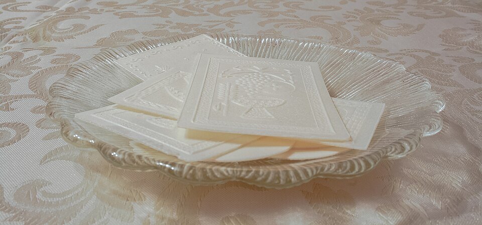 Opłatek, the embossed Christmas wafer shared before the Wigilia supper