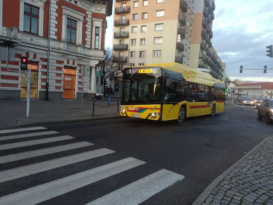 Yellow electric MPK bus in Włocławek at a pedestrian crossing