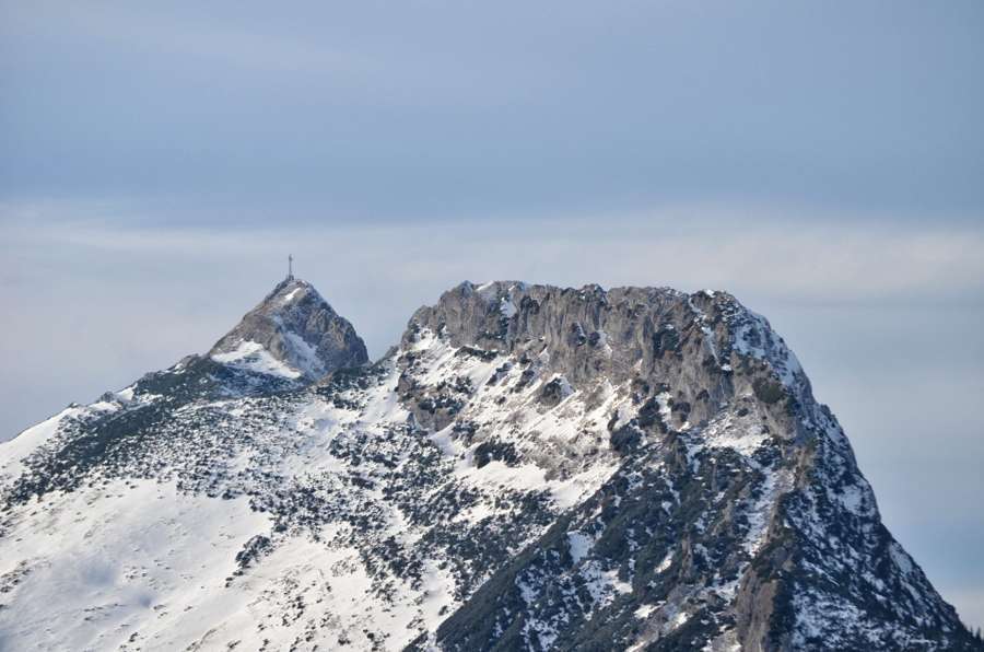 Giewont peak above Zakopane covered in snow under a pale winter sky