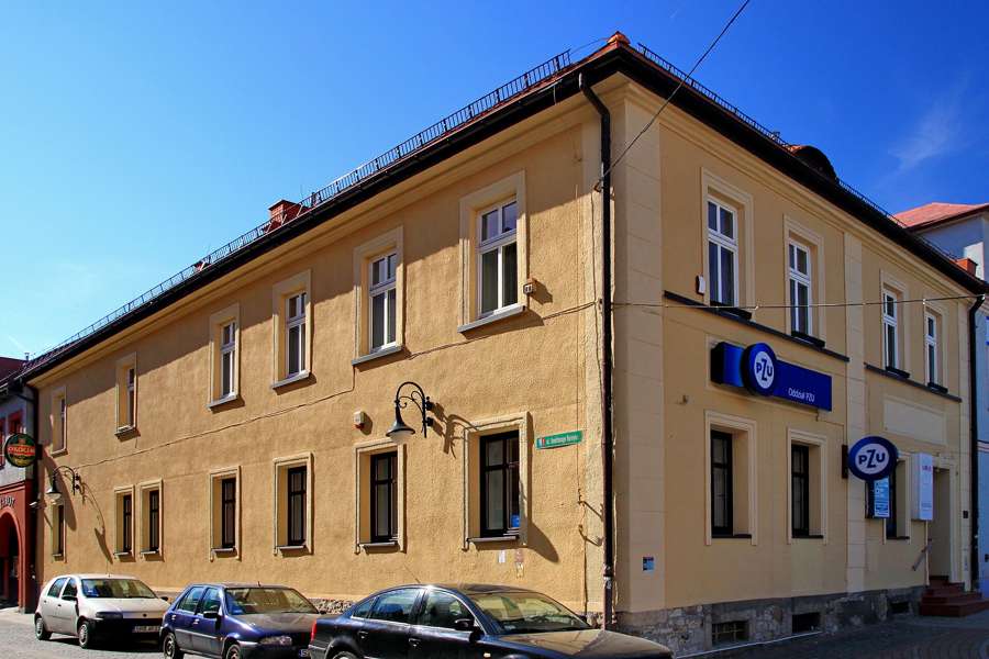 Historic townhouse at Rynek 12 in Żory with a pharmacy sign